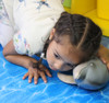 Jumbo dolphin toy for children - child playing view 1
