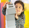child stacking our foam breeze blocks