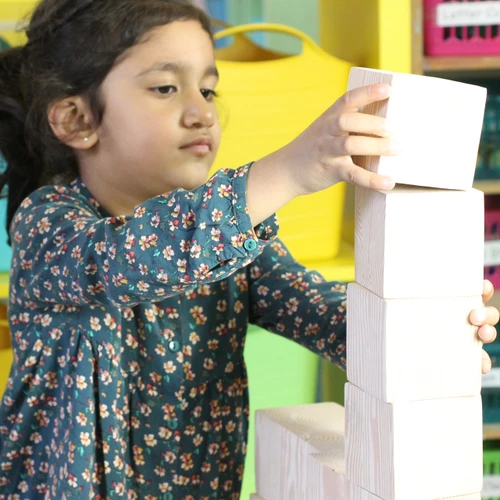 child building with blocks