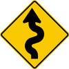 diamond shape, yellow and black, sign features an arrow winding to the left