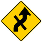diamond shape, yellow and black sign features an arrow with a line through it.