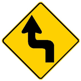 black and yellow diamond shaped sign showing a left reverse turn in road ahead