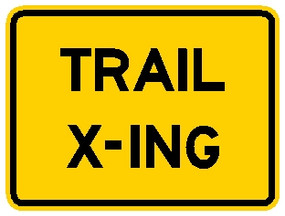 rectangular, yellow sign, black words "Trail X-ing"