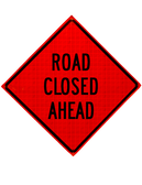 diamond shape, orange and black sign, "Road Closed Ahead"