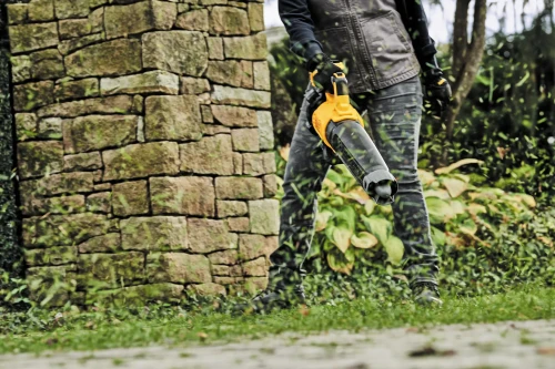 DEWALT DCBL722P1 Handheld Blower in use