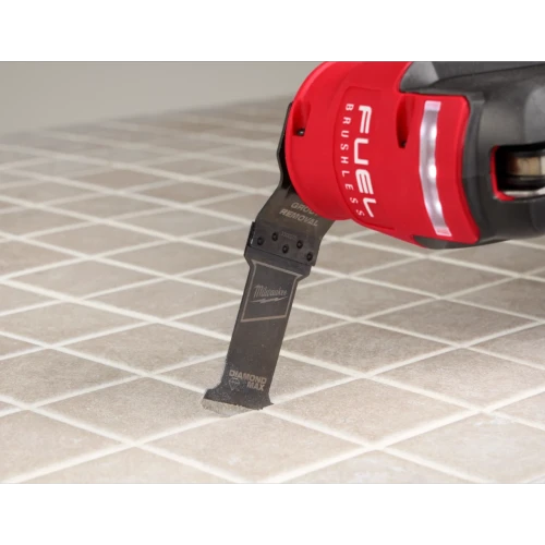 Milwaukee DIAMOND MAX grout plunge blade in use on tile