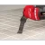 Milwaukee DIAMOND MAX grout plunge blade in use on tile