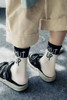 shut up slogan socks in black and white