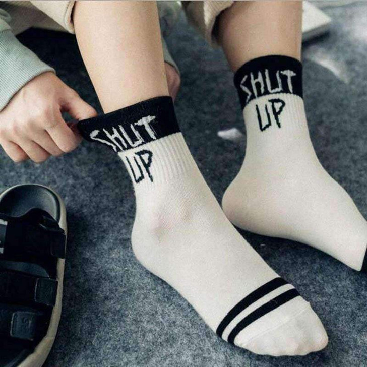 shut up slogan socks in black and white