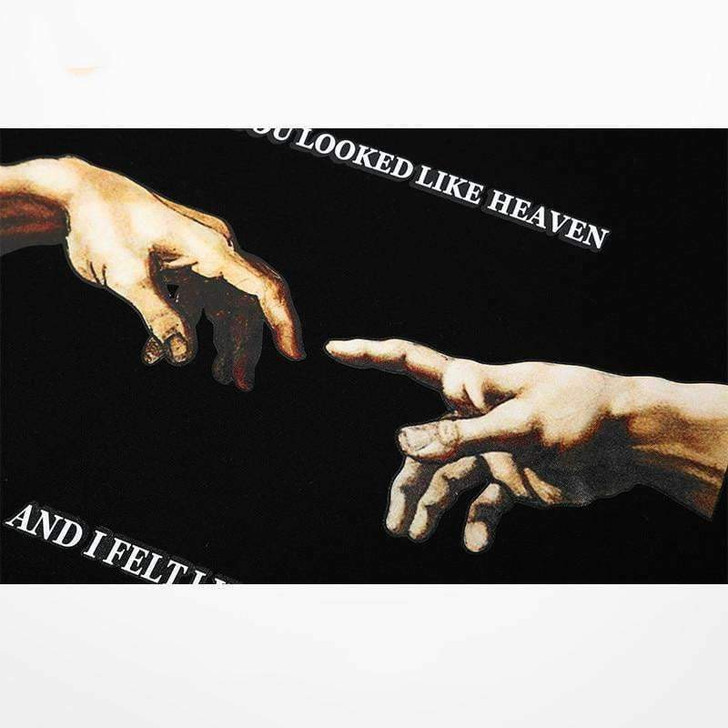 you looked like heaven and i felt like hell hoodie in black with the image of the creation of adam you looked like heaven and i felt like hell hoodie in black with the image of the creation of adam