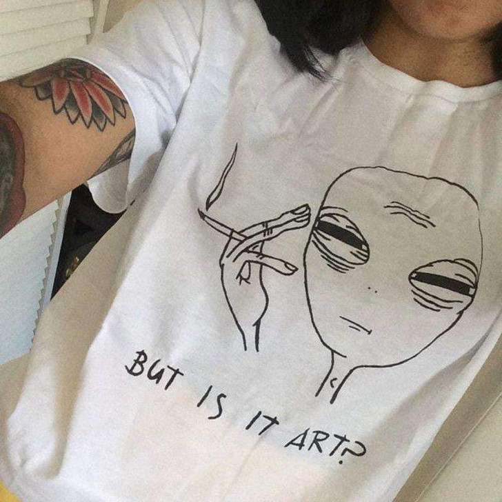 but is it art white tee with a drawing of an alien smoking but is it art white tee with a drawing of an alien smoking