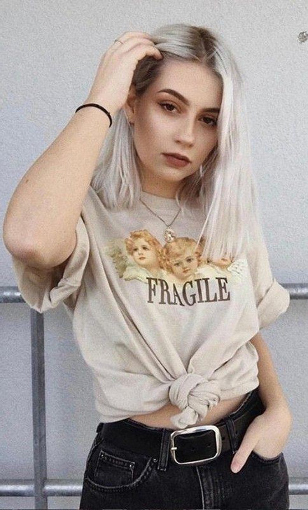 fragile tee in khaki with the picture of three baby angels