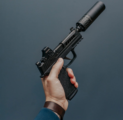 True Precision Sig Sauer P365 XL with Black slide and black threaded barrel with a suppressor.
