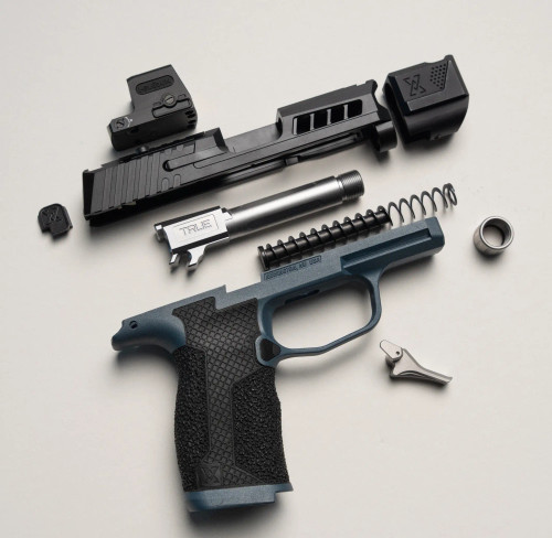 Sig P365 exploded view with True Precision threaded barrel, axiom slide, True-Lock Compensator, flat trigger, and hybrid hand stippled lower
