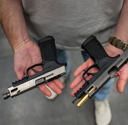 Two Sig P365 FUSEs with True Precision Non-threaded and threaded barrels being held