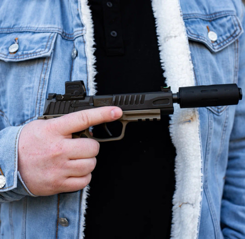 True Precision Sig Sauer P365 FUSE with threaded barrel and suppressor black being held.