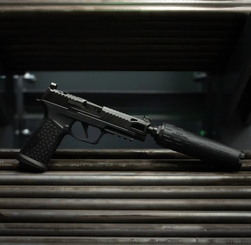 Sig P365 FUSE with Black Nitride True Precision threaded barrel, and slide, and black suppressor on raw steel bars