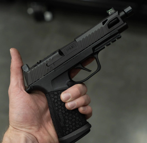 Sig P365 FUSE with Black Nitride True Precision threaded barrel, and slide being held