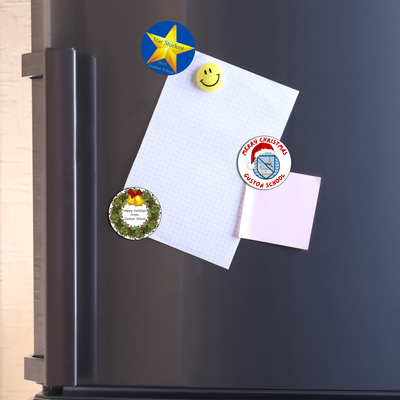 3 of our flexible magnets in various designs on a fridge