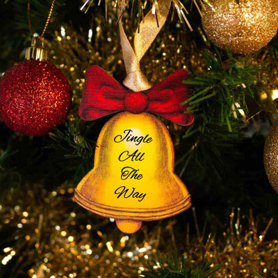 Wooden Bell Shaped Christmas Decoration 'Jingle All the Way' hanging on a Christmas tree