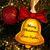 A picture of one of our Christmas Bell Wooden decorations hanging up in a Christmas Tree.