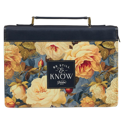 Printed rose design against blue background 
Royal blue faux leather 
Royal blue faux leather patch 
White text 
Be still and know that I am God
Psalm 46:10 
Entire verse on back 
Fashion Bible cover  
Blue faux leather carry handle  
Gold metal handle hardware  
Gold metal zipper pull  
2 pen loops  
Black and red ribbon markers 