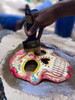 This Painted Skull Mask Embodies a Fusion of Haitian and Mexican Cultural Elements