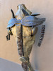 This is a handmade metal art sculpture from Croix-des-Bouquets Haiti made of recycled oil barrels using a hammer and a chisel. This sculpture depicts a horse head skull embellised with metal. This is a vintage voodoo piece.
