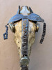 This is a handmade metal art sculpture from Croix-des-Bouquets Haiti made of recycled oil barrels using a hammer and a chisel. This sculpture depicts a horse head skull embellised with metal. This is a vintage voodoo piece.