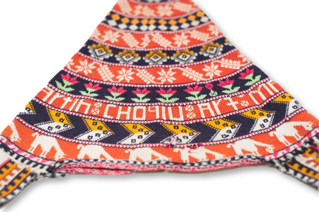 This vintage Andean Peruvian Bolivian ch'ullo colorful alpaca wool knit ear-flap folk hat dates from the mid 20th century. Bolivian ch'ullo style knit hat has ear-flaps for warmth and is missing the tie strap to secure under the chin. 
21" from top to ear-flaps 11" width