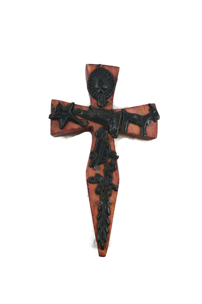 small wooden cross with milagro hearts