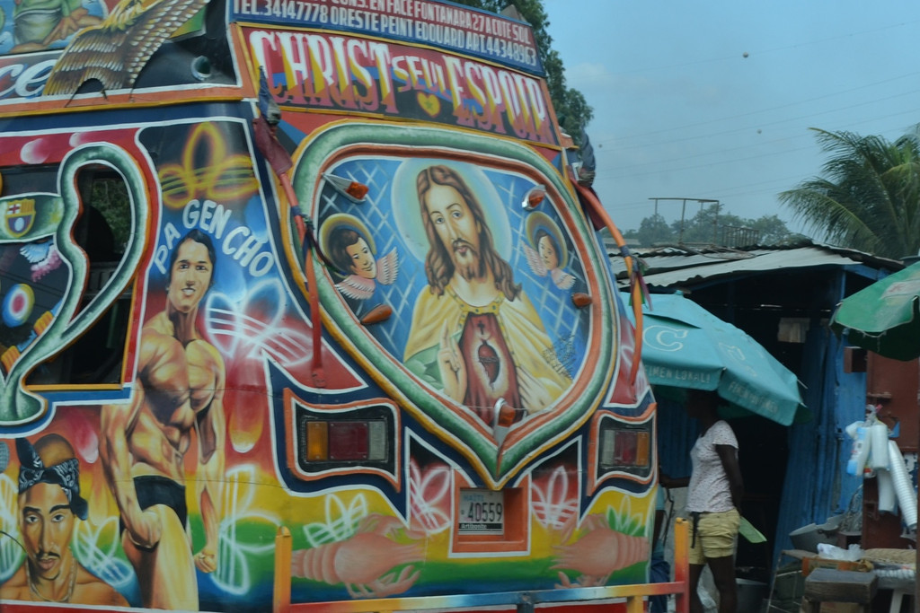 Some Haitian tap tap buses promote movie stars, or fictional characters, but religious imagery is most common.