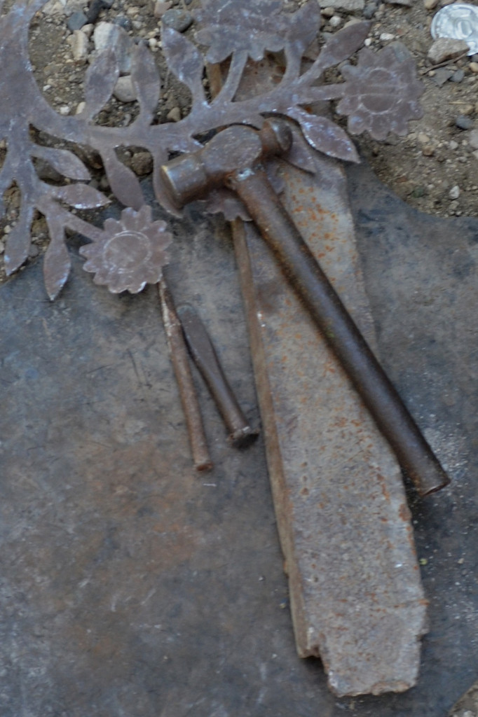 Primitive tools used making a Haitian metal sculpture - hammer and chisel