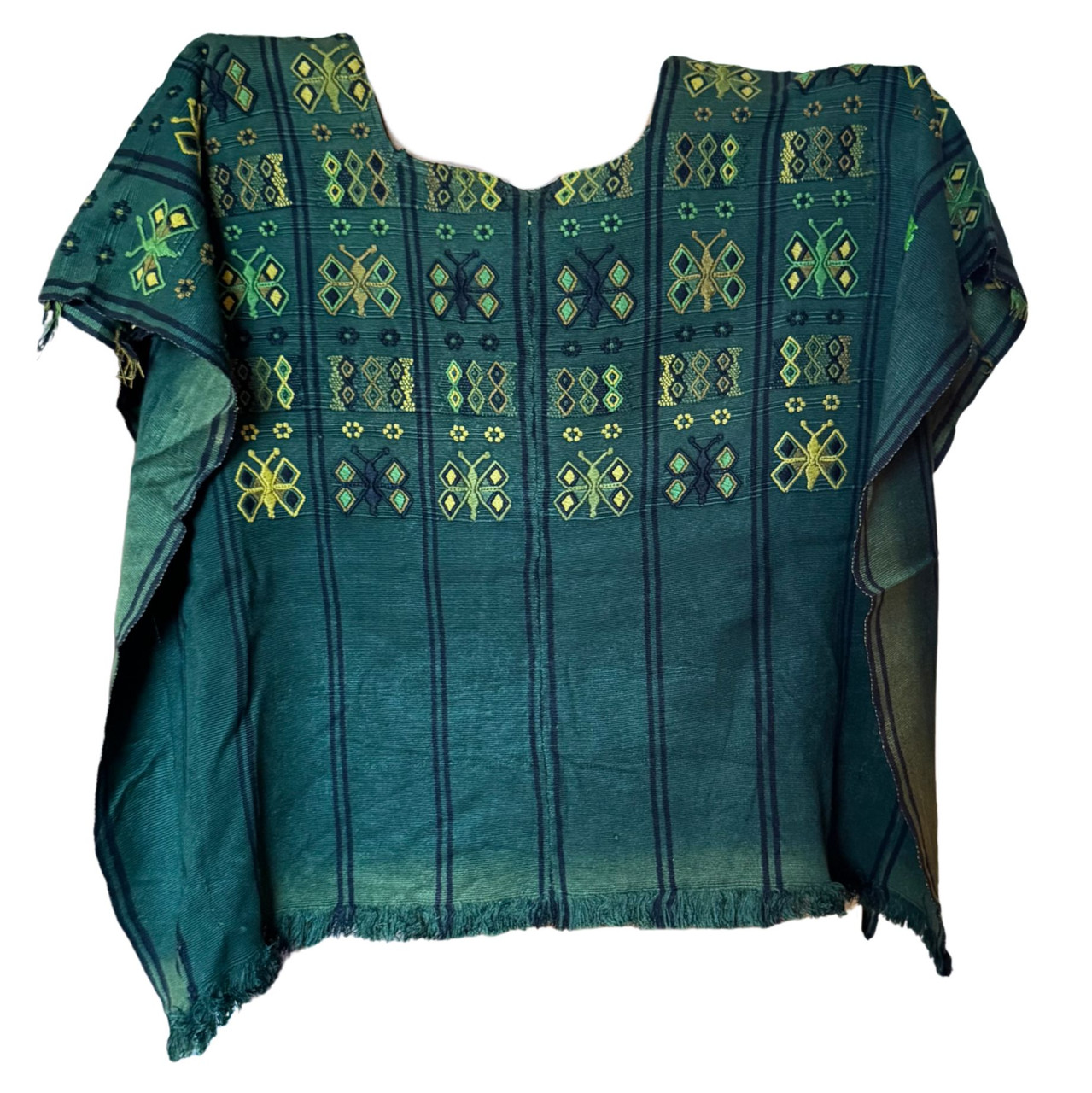 This Huipil, has a bit of fading telling a story of its journey and the love it has received over time.