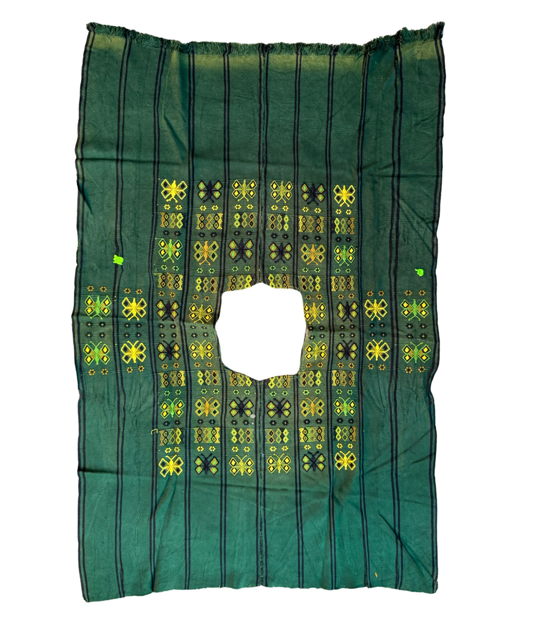 This Huipil, has a bit of fading telling a story of its journey and the love it has received over time.