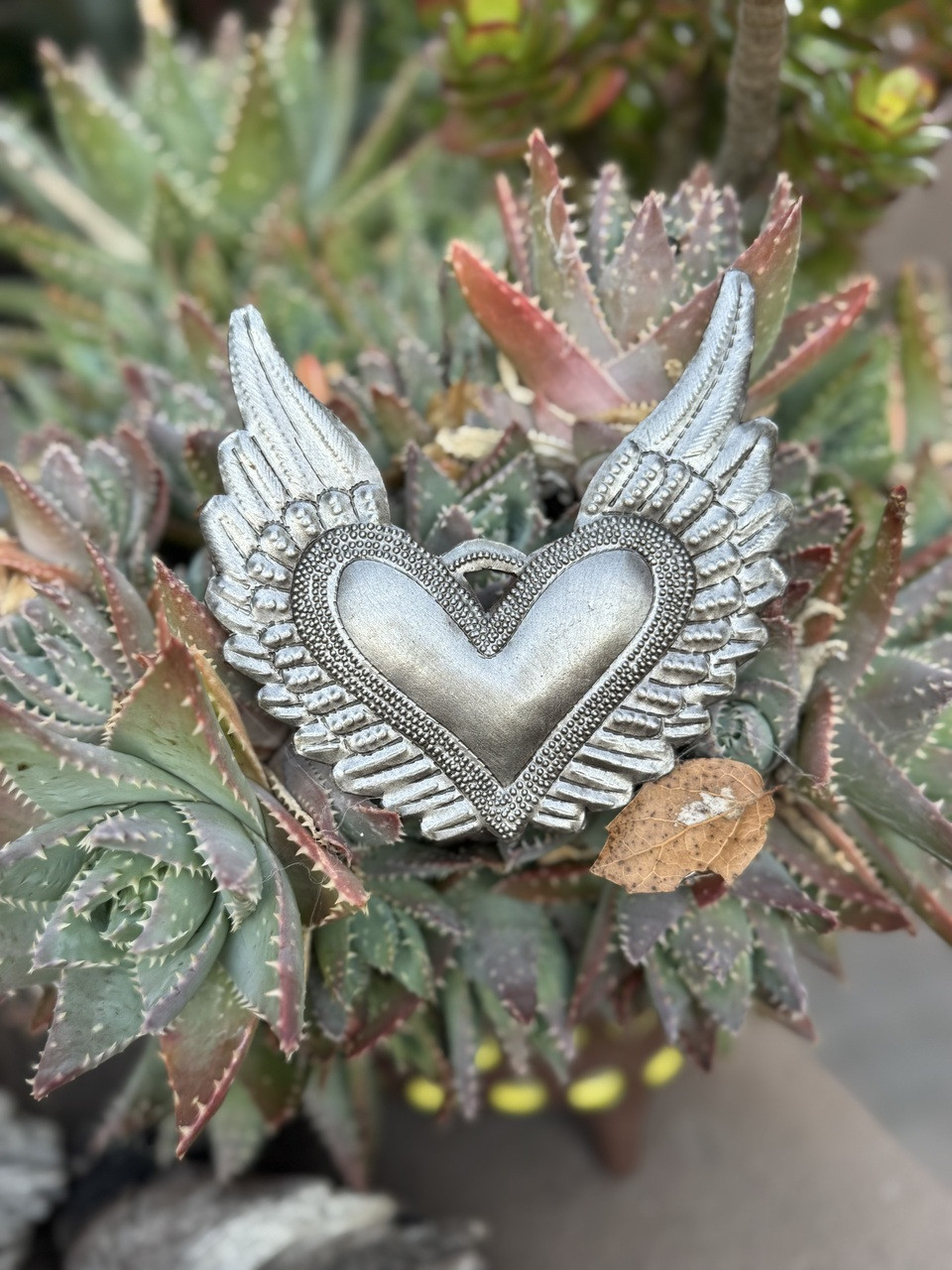 Haitian metal art, recycled steel heart, fair trade wall décor, handmade metal sculpture, Haitian heart wall art, eco-friendly home décor, hand-hammered steel