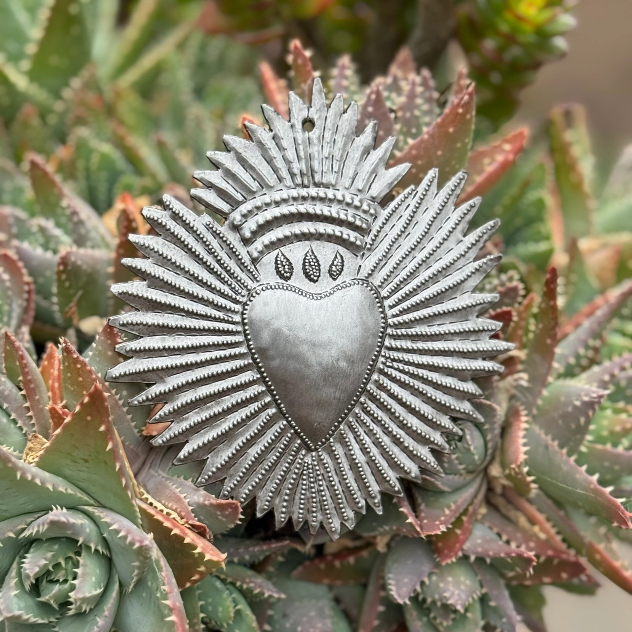 Haitian metal art, recycled steel heart, fair trade wall décor, handmade metal sculpture, Haitian heart wall art, eco-friendly home décor, hand-hammered steel art