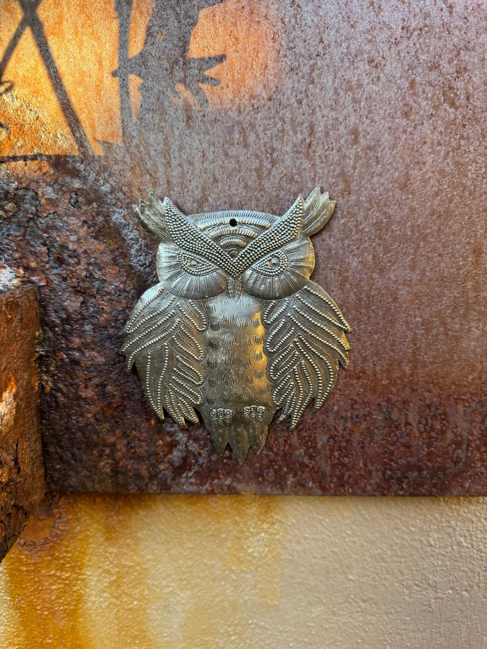 HANDMADE IN HAITI – Individually hand-cut and hammered by skilled Haitian artisans using recycled steel oil barrels.