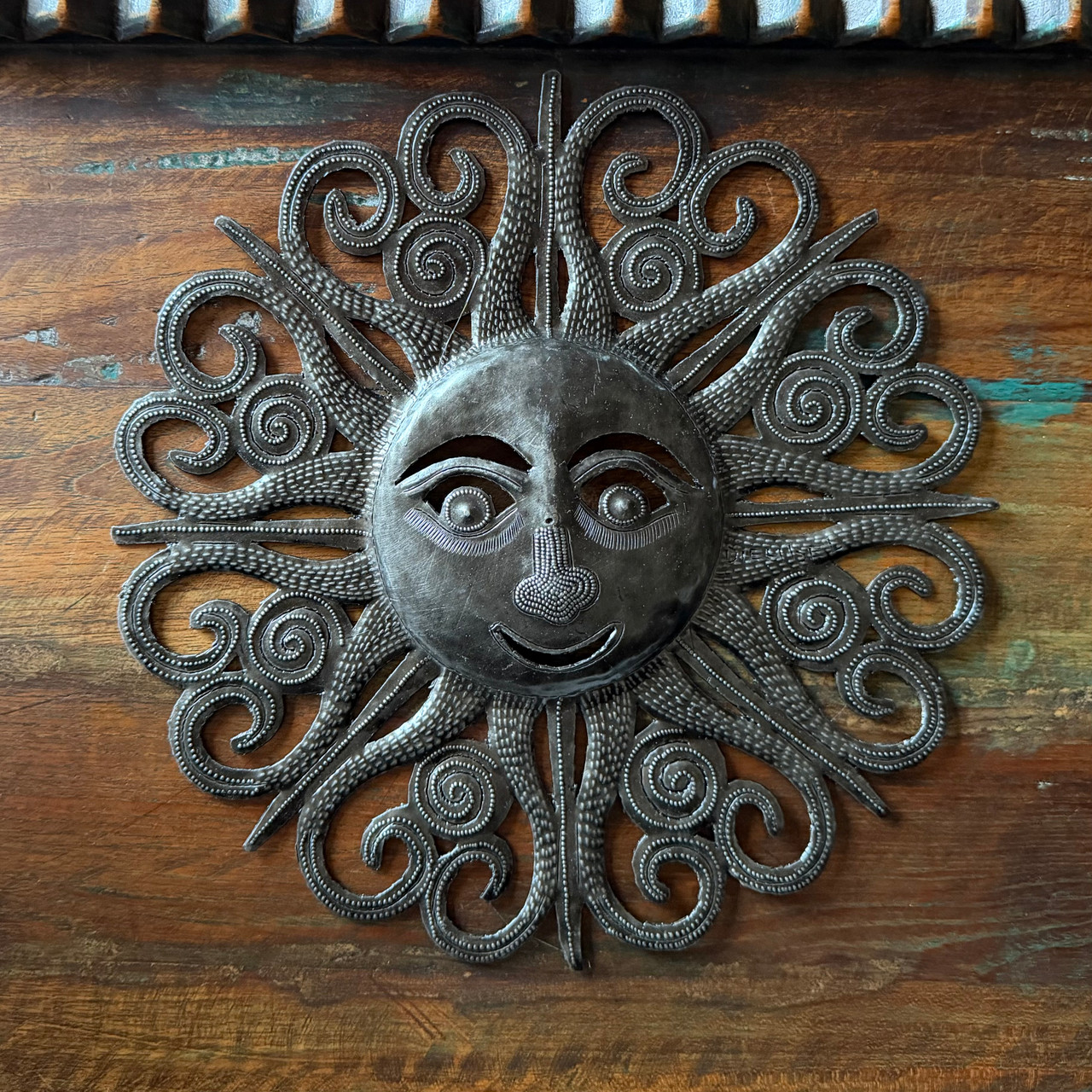 sun face wall art
metal sun decor
Haitian metal art
sunburst wall decor