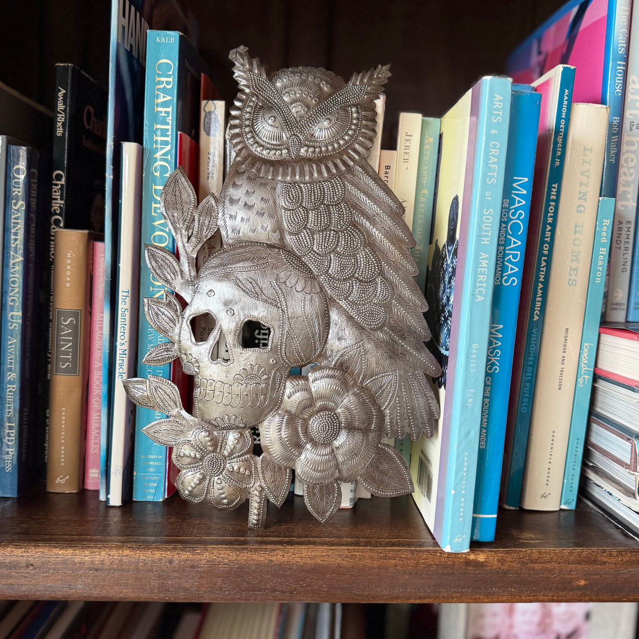 Hand-cut steel wall art featuring an owl and skull design with flowers, 11.5 inches, from Haiti.