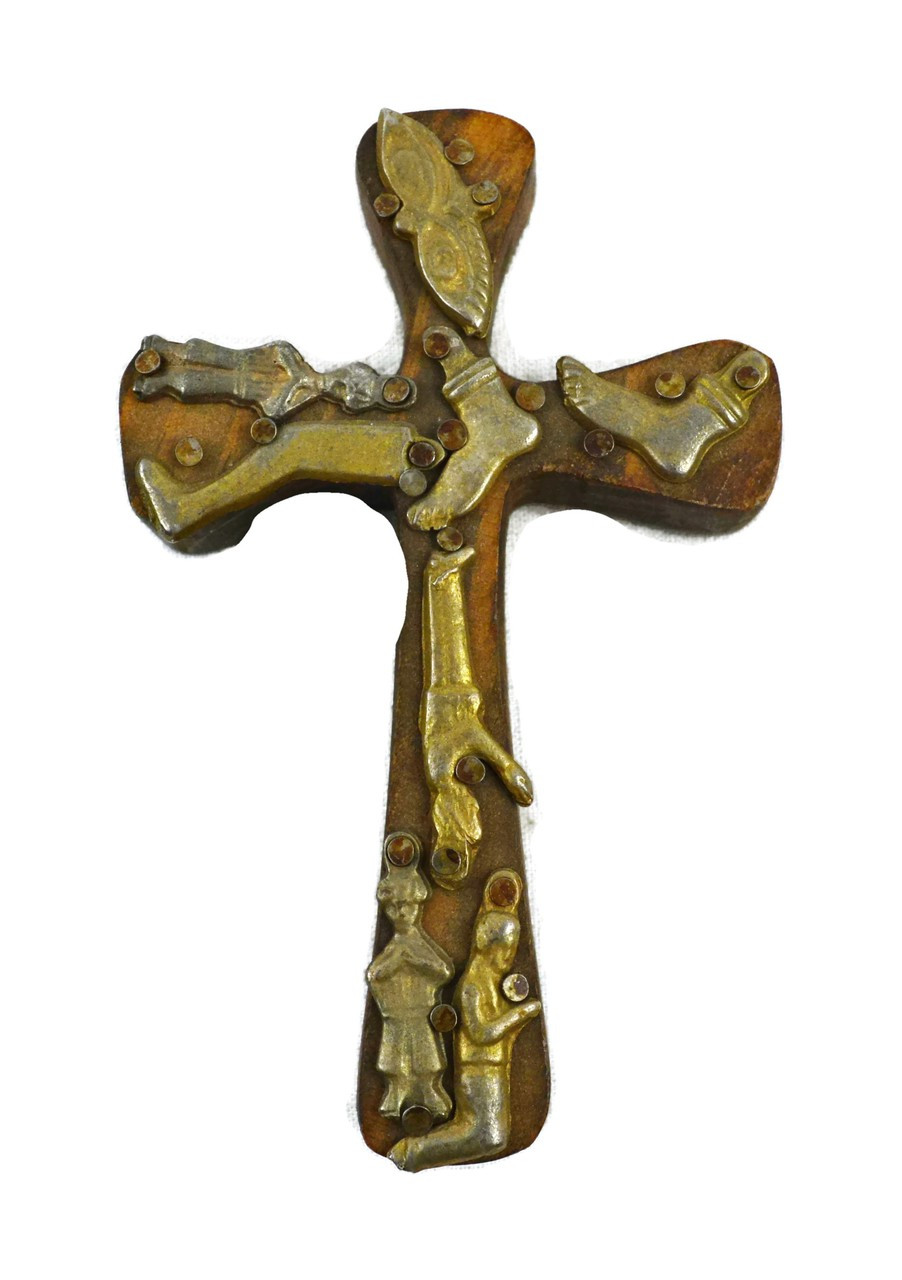 small wooden cross with milagro hearts