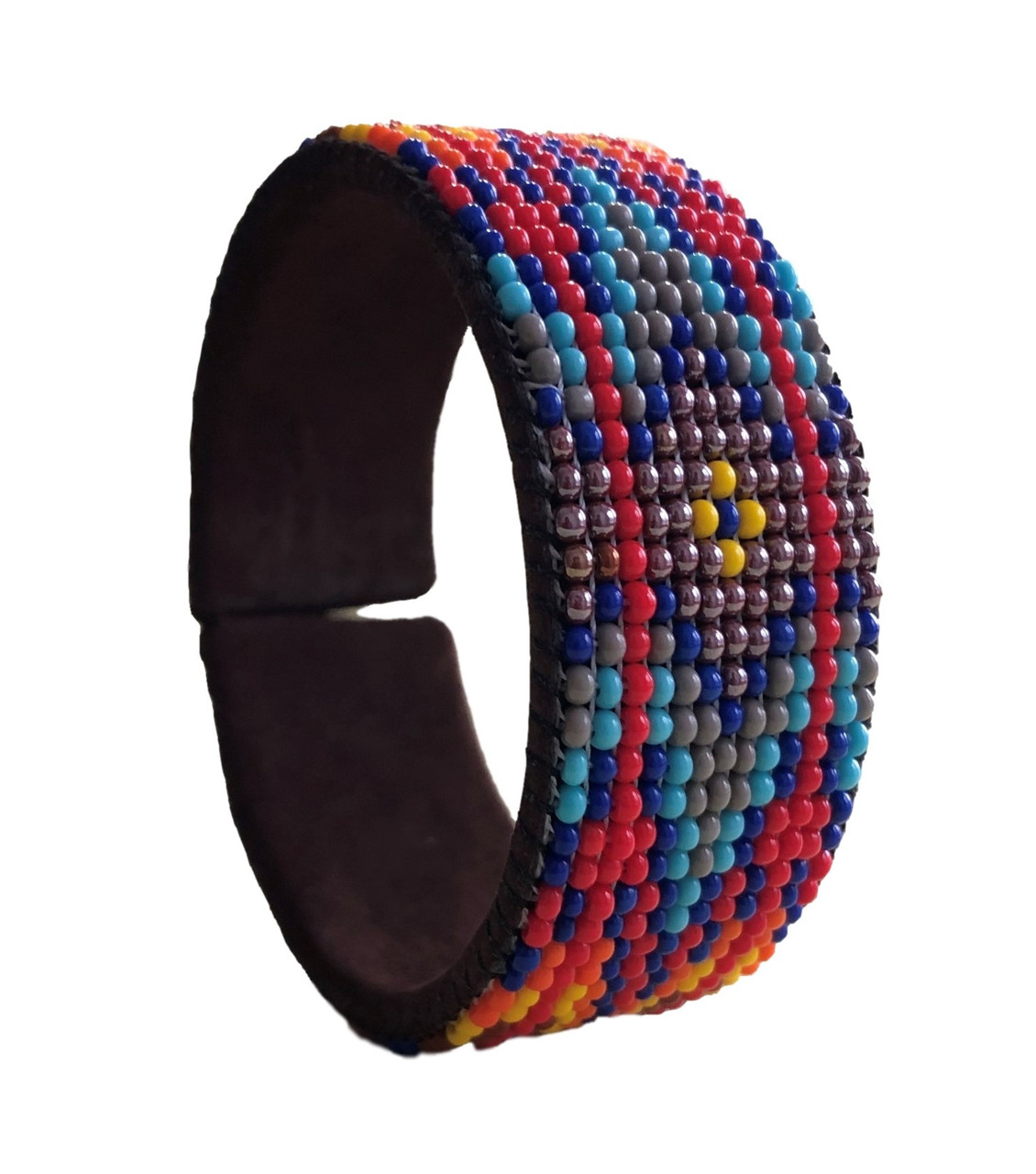 Luminous seed beads stitched onto suede leather over adjustable cuff – one size fits most. 1” x 5.75”