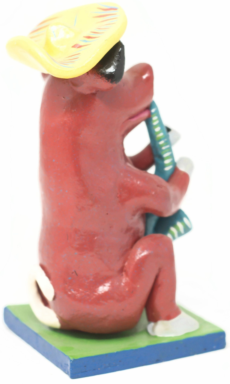 Ortega Sitting Pig, Proud, Playing the Sax