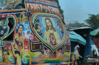 Some Haitian tap tap buses promote movie stars, or fictional characters, but religious imagery is most common.
