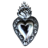 A heart stands for love, relationship, and commitment. A flaming heart specifically represents passion for something or someone. Flaming Sacred Heart