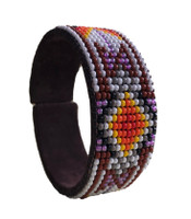 Luminous seed beads stitched onto suede leather over adjustable cuff – one size fits most. 1” x 5.75”