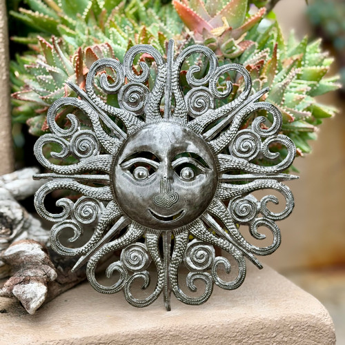 sun face wall art
metal sun decor
Haitian metal art
sunburst wall decor
