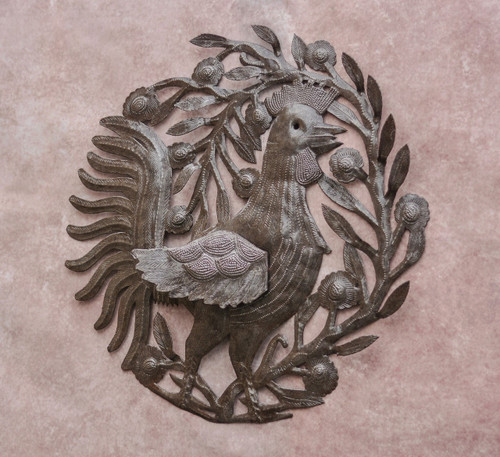 The rooster is made of recycled oil drums and has variations in color. 
When display indoor the color appears dark silver with bronze tones, outside appears silver, oil bronzed. The rooster is made of recycled oil drums and has variations in color. 
When display indoor the color appears dark silver with bronze tones, outside appears silver, oil bronzed.