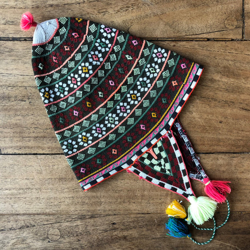 This vintage Andean Peruvian Bolivian ch'ullo colorful alpaca wool knit ear-flap folk hat dates from the late 19th century.