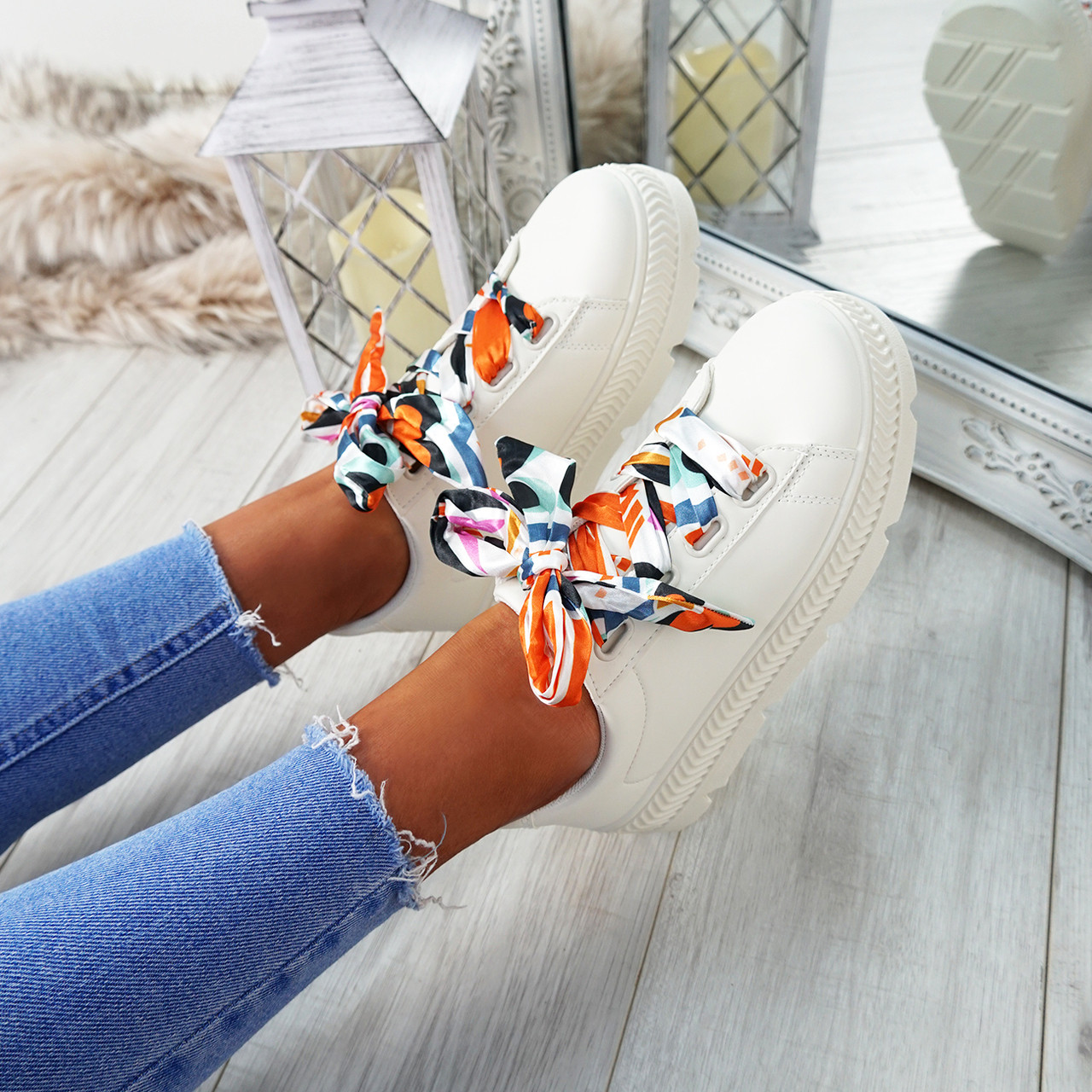 white sneakers with ribbon laces
